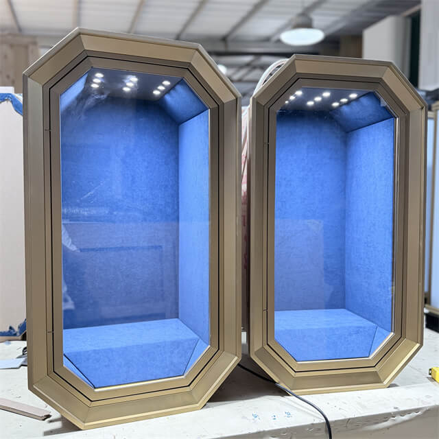 Octagonal wall-mounted jewelry display cabinet with champagne gold frame, blue velvet lining, and LED lighting — custom by Shangyuan Display